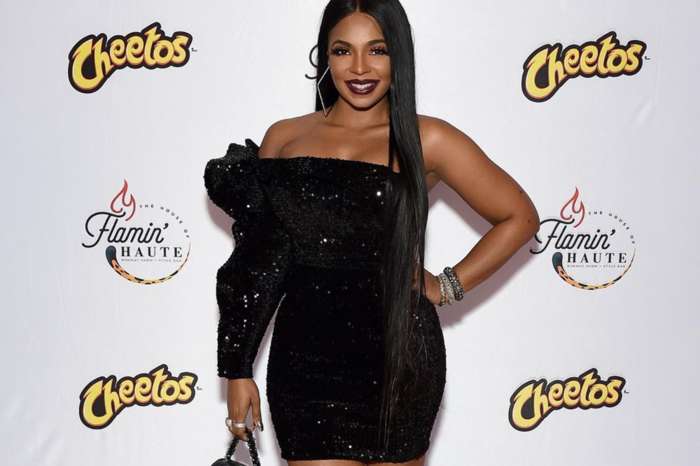 Ashanti Is No Match For This Gorgeous Stallion In This Photo Despite Wearing A Leather Swimsuit
