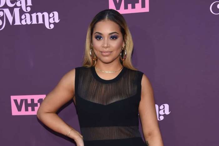 Lauren London Shares Never-Before-Seen Photo Where Nipsey Hussle Is Securing His Queen -- Rain Or Shine He Was A Great Man