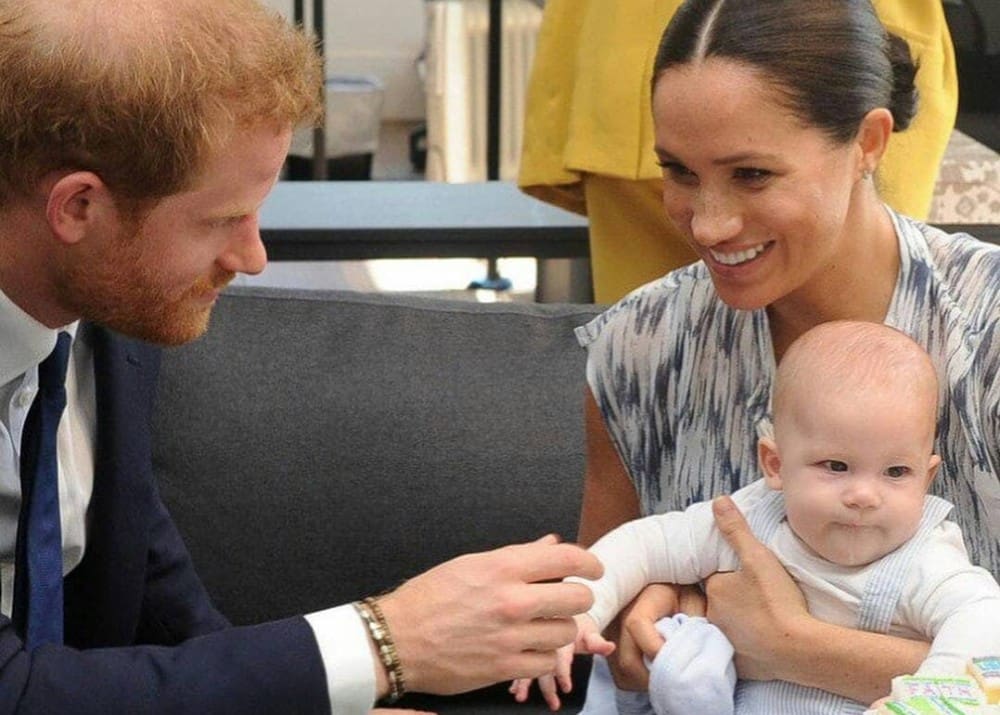 video-showing-royal-baby-archie-giving-bishop-desmond-tutu-a-high-five-as-meghan-markle-and-prince-harry-watchgoes-viral