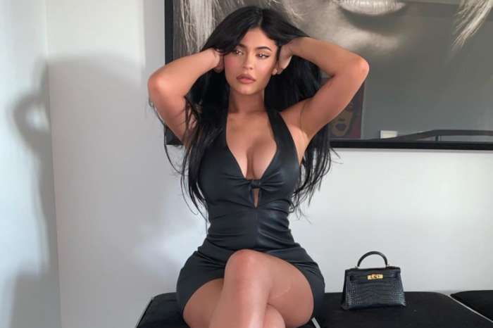 Kylie Jenner Can't Resist Showing Off Her Curves In Plunging Little Black Dress