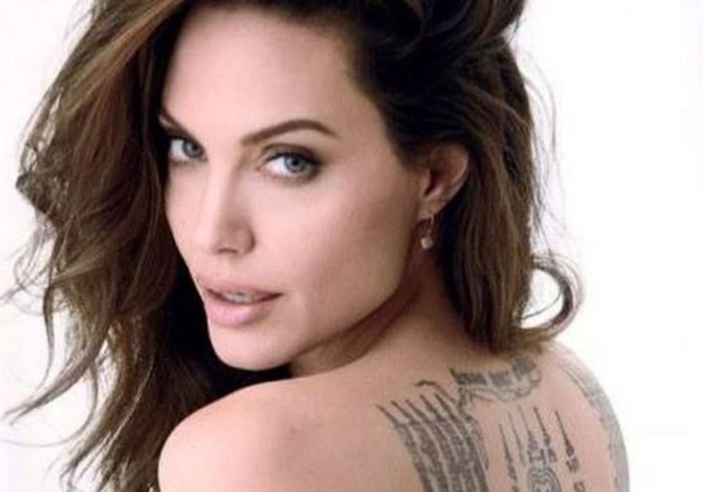 Angelina Jolie Poses Nude For Magazine Cover And Reveals Brad Pitt Has Kept Her From Moving Overseas
