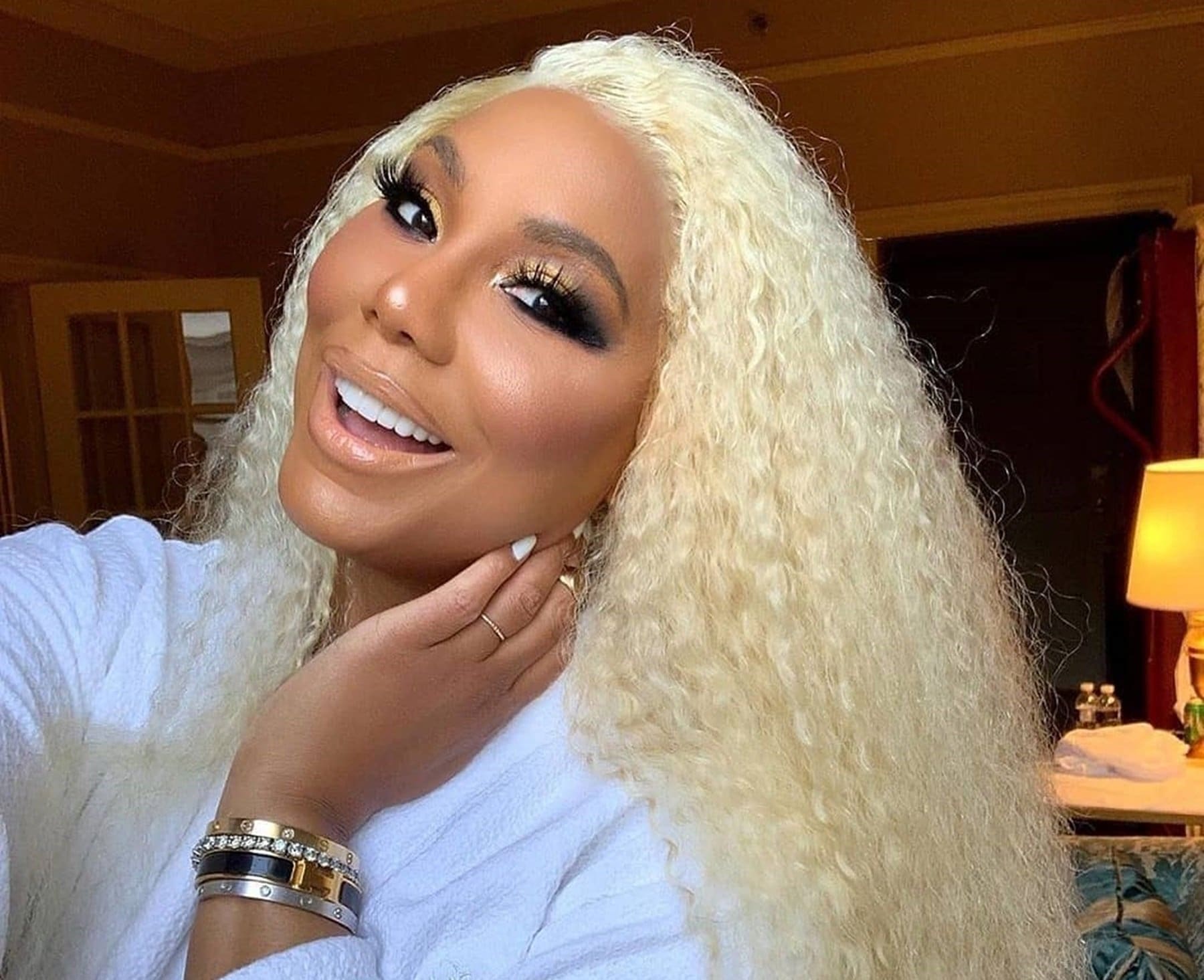 tamar-braxton-enters-the-new-year-with-sultry-pink-bathing-suit-in-latest-video-as-bf-david-adefeso-gets-ready-to-rock-her-world