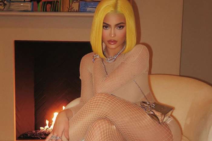 Kylie Jenner Wears Another Banana-Yellow Wig And Pairs It With A Flesh-Colored Fishnet Catsuit