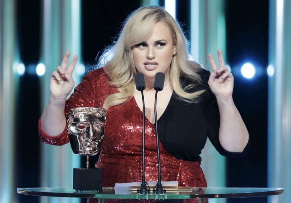 Rebel Wilson Roasts Royal Family & Burns The BAFTAs For Lack Of Female Nominees While Presenting Best Director Award