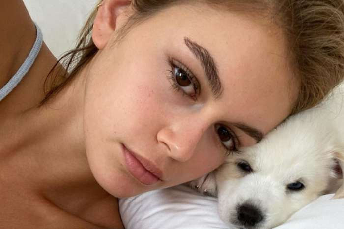 Kaia Gerber Wears A Two-Piece Bathing Suit And Snuggles Two Cuddly Puppies As She's Photographed Without Her Cast