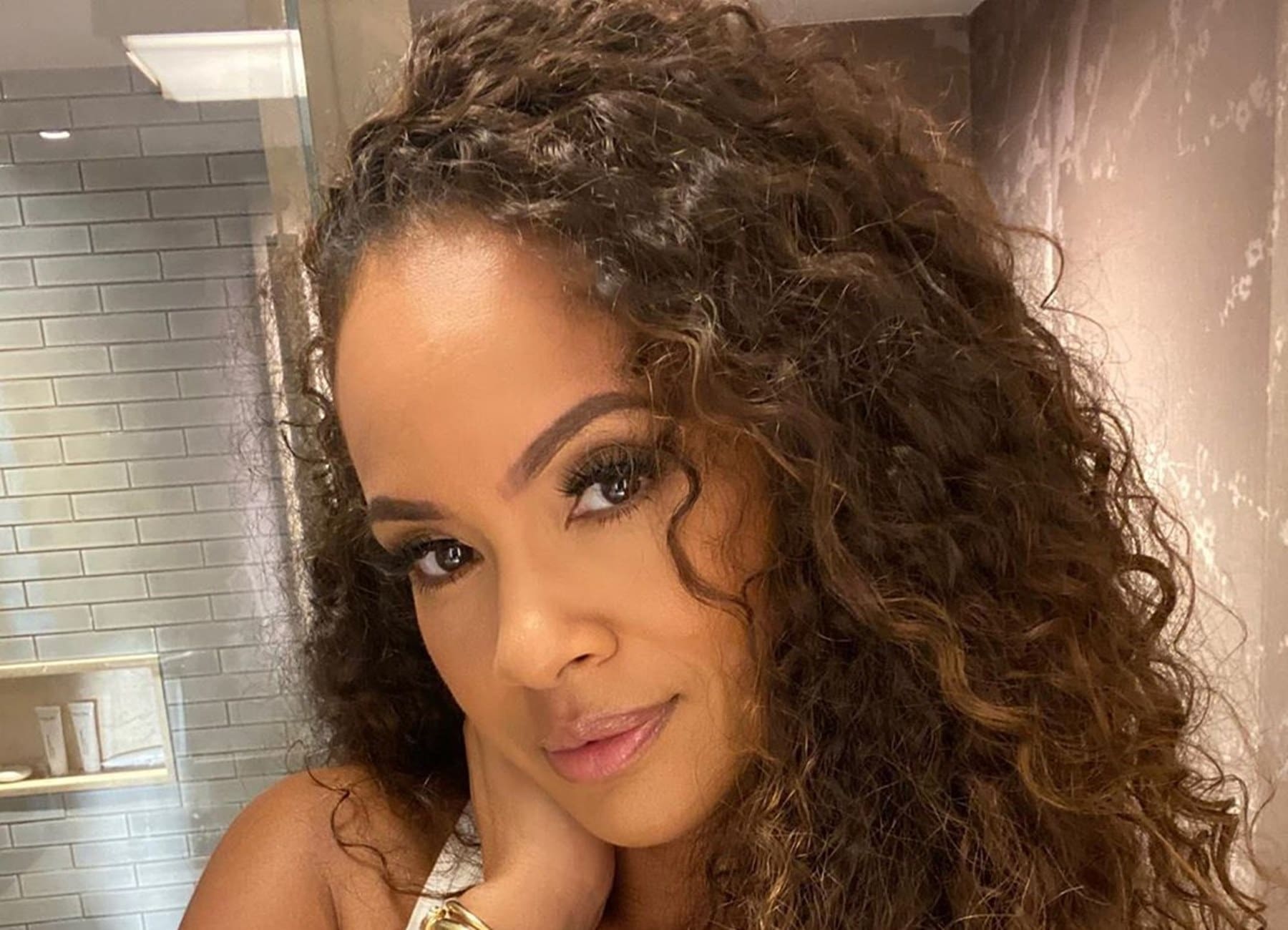 Evelyn Lozada Shares Scandalous Bathing Suit Photos That Have Young Men Trying To Stray Her From Her Religious Path Celebrity Insider pic photo
