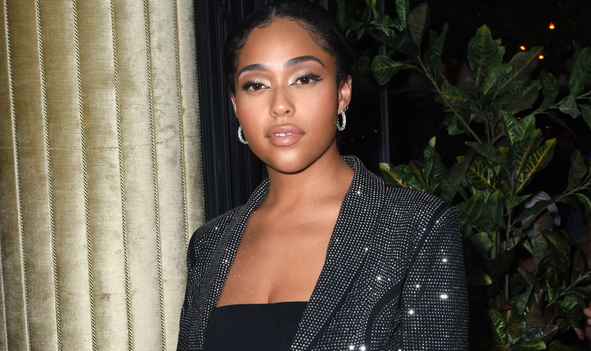 Jordyn Woods Rocks Her Curves In This Pink Skin-Tight Dress - Fans Ask For A Beauty Line