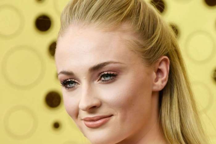 Sophie Turner Shows Off Growing Baby Bump In Body Hugging Jumpsuit With Guns N' Roses Flannel