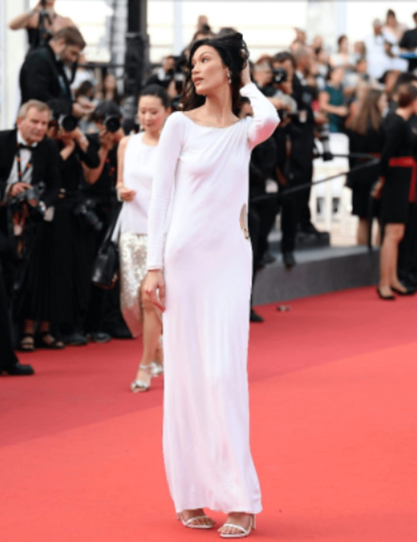 Bella Hadid, in a vintage Gucci dress with a slit on the thigh, took to the red carpet of Cannes