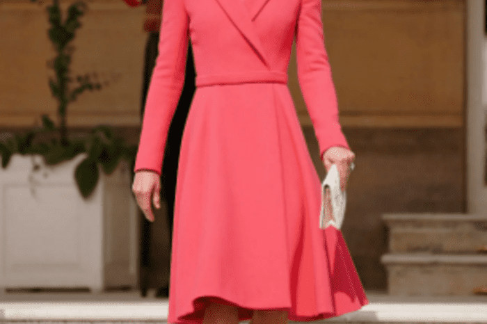 As always, the impeccable Kate Middleton in a coral coat dress receives guests in the garden of Buckingham Palace