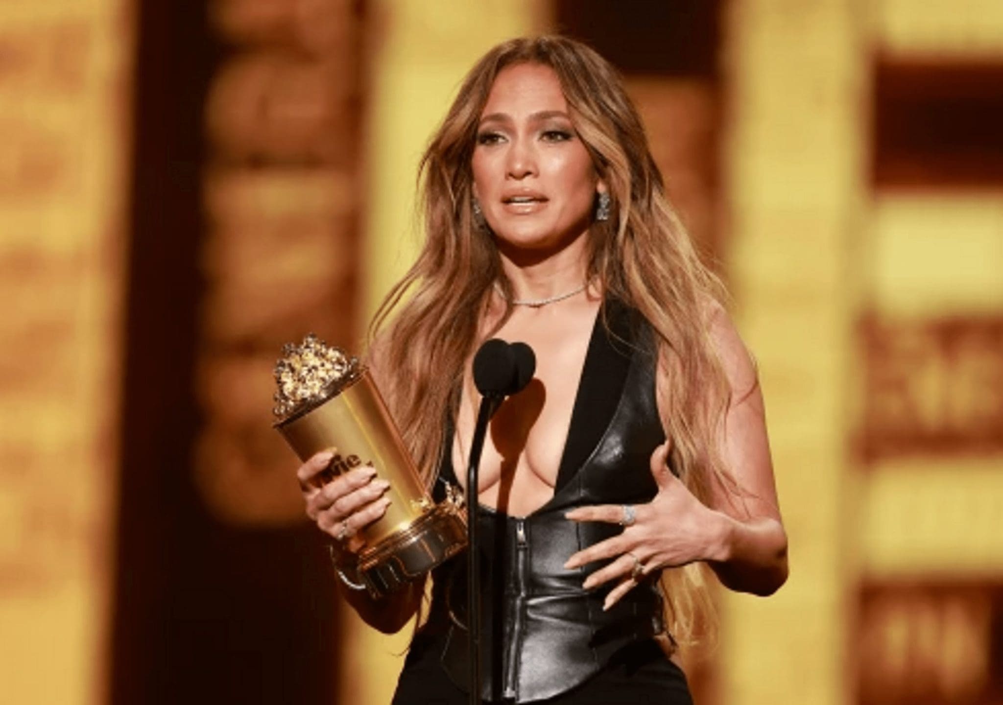 Jennifer Lopez, in a leather top with an impressive neckline, made a splash on the red carpet