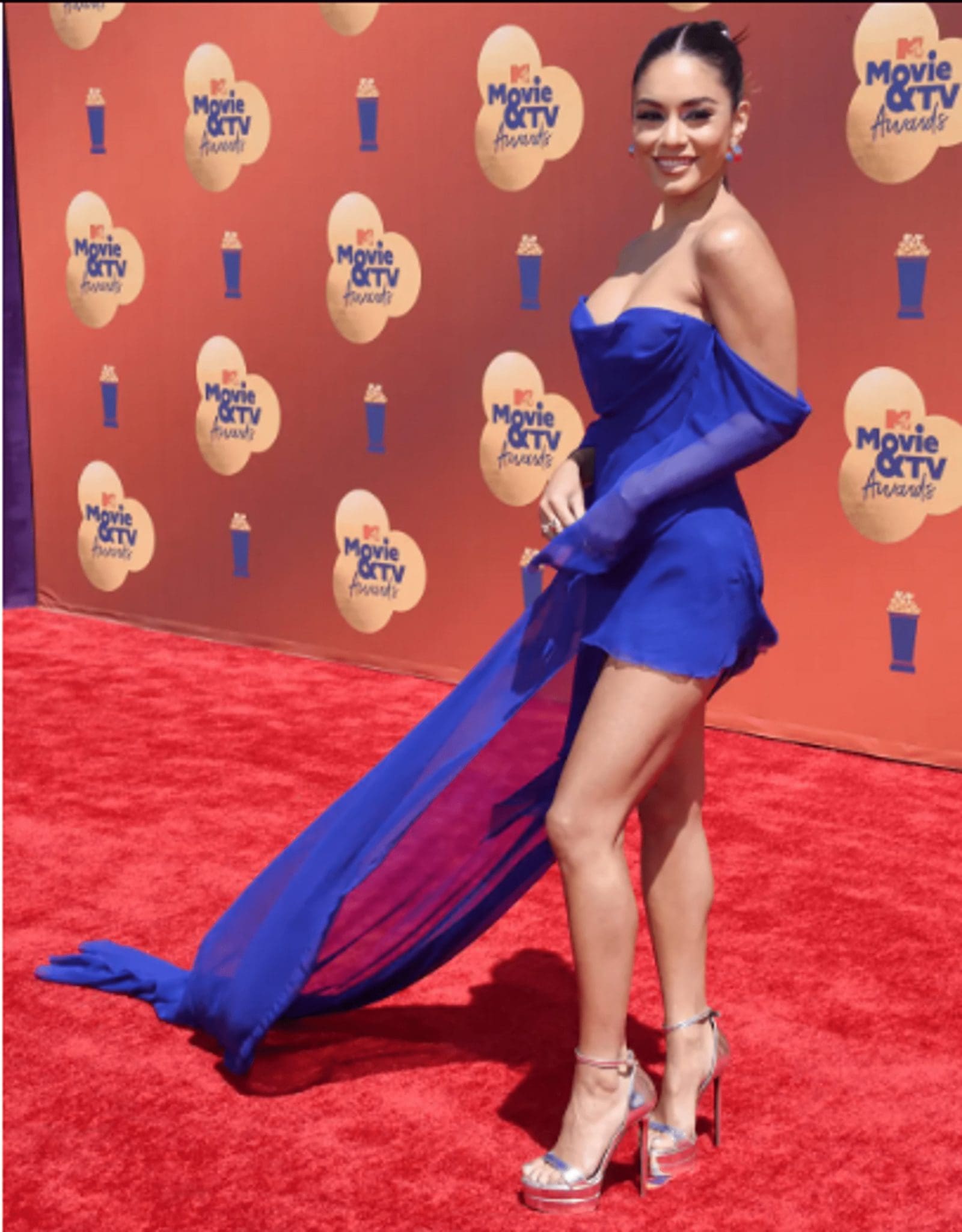 Vanessa Hudgens in an electric blue dress with a flowing train and other guests of the MTV Movie & TV Awards 2022