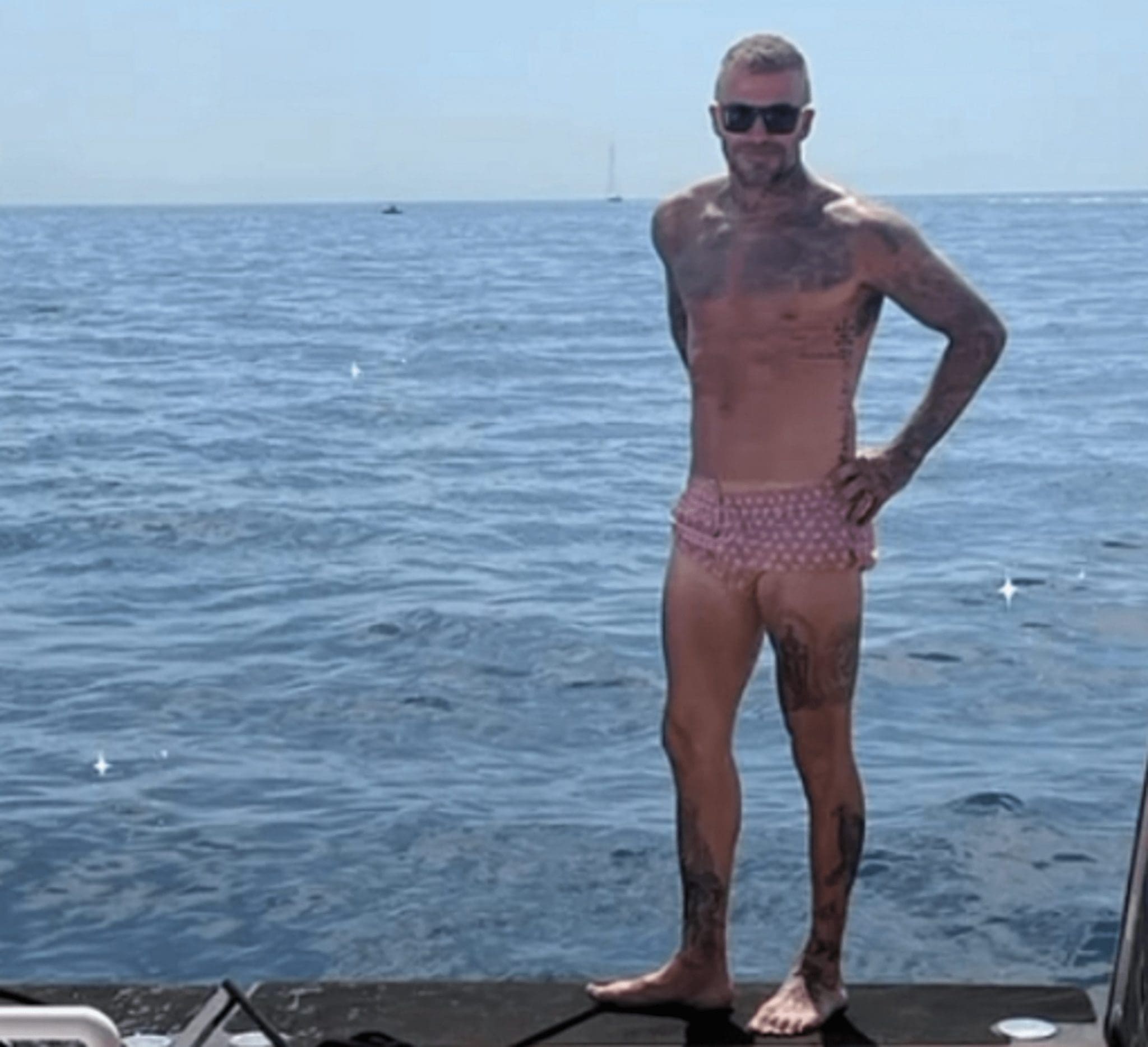 While On A Yacht Holiday With His Family, David Beckham Flaunts His Muscles And Tattoos In A Pink Parachute Bikini