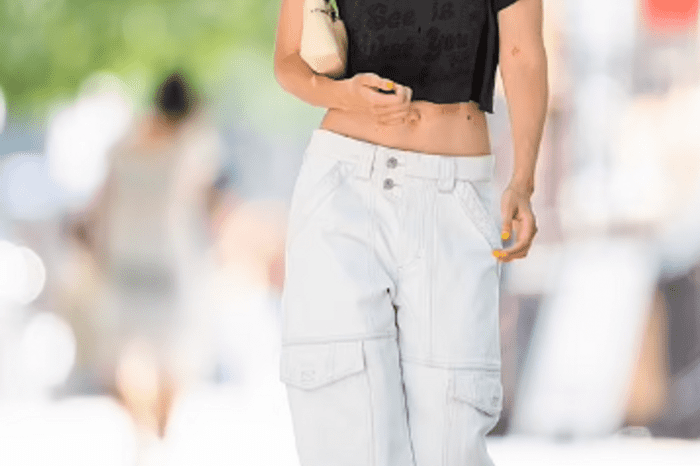 In A Low-Rise Pair Of White Slacks And A Black Crop Top, Gigi Hadid Appeared Beautiful And Carefree