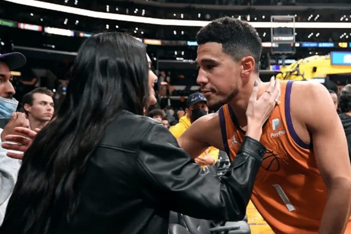 In A Sweet Vacation Picture, Kendall Jenner Is Seated On Devin Booker's Lap
