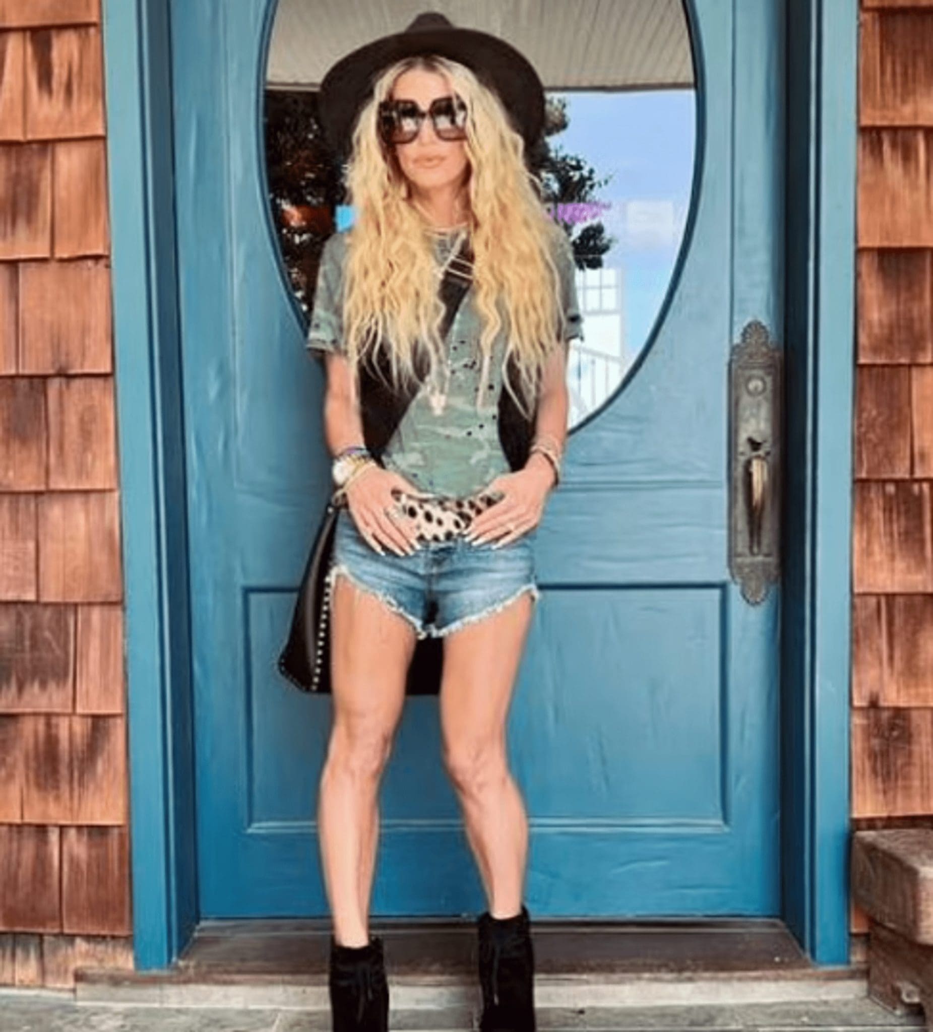 Jessica Simpson Flaunted Her Trim Figure In A Green Camouflage T-Shirt And A Pair Of Torn Daisy Dukes Shorts