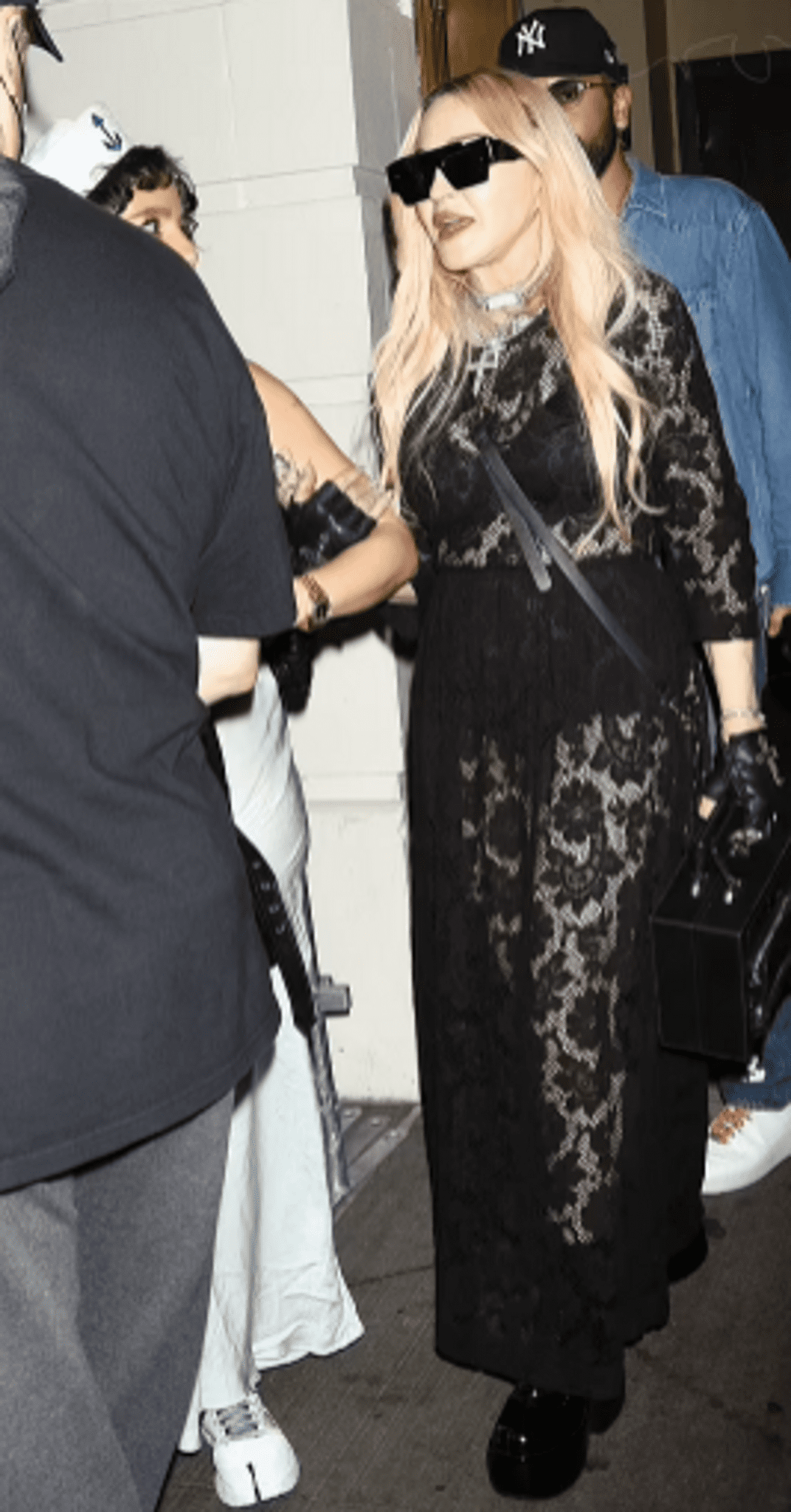 As She Exits MJ, Madonna Puts Up A Spectacle By Flashing Her Bra And Underpants While Wearing A Sheer Black Lace Dress