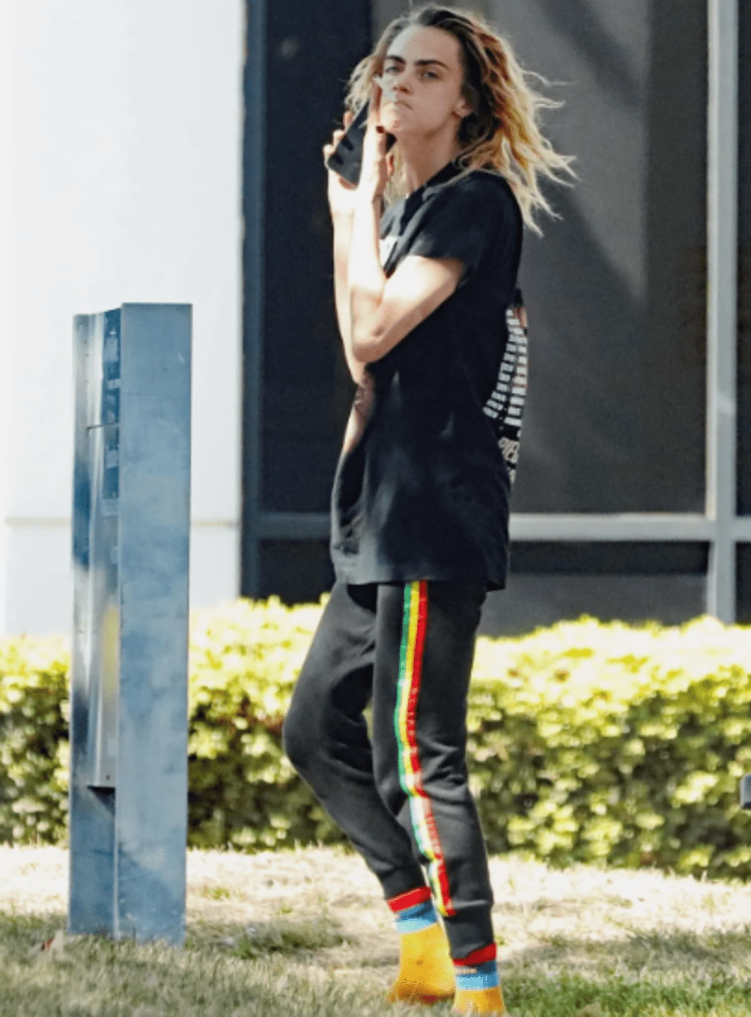Cara Delevingne, A Supermodel, Removed Her Shoes And Walked Across The Tarmac Wearing Only Orange Socks
