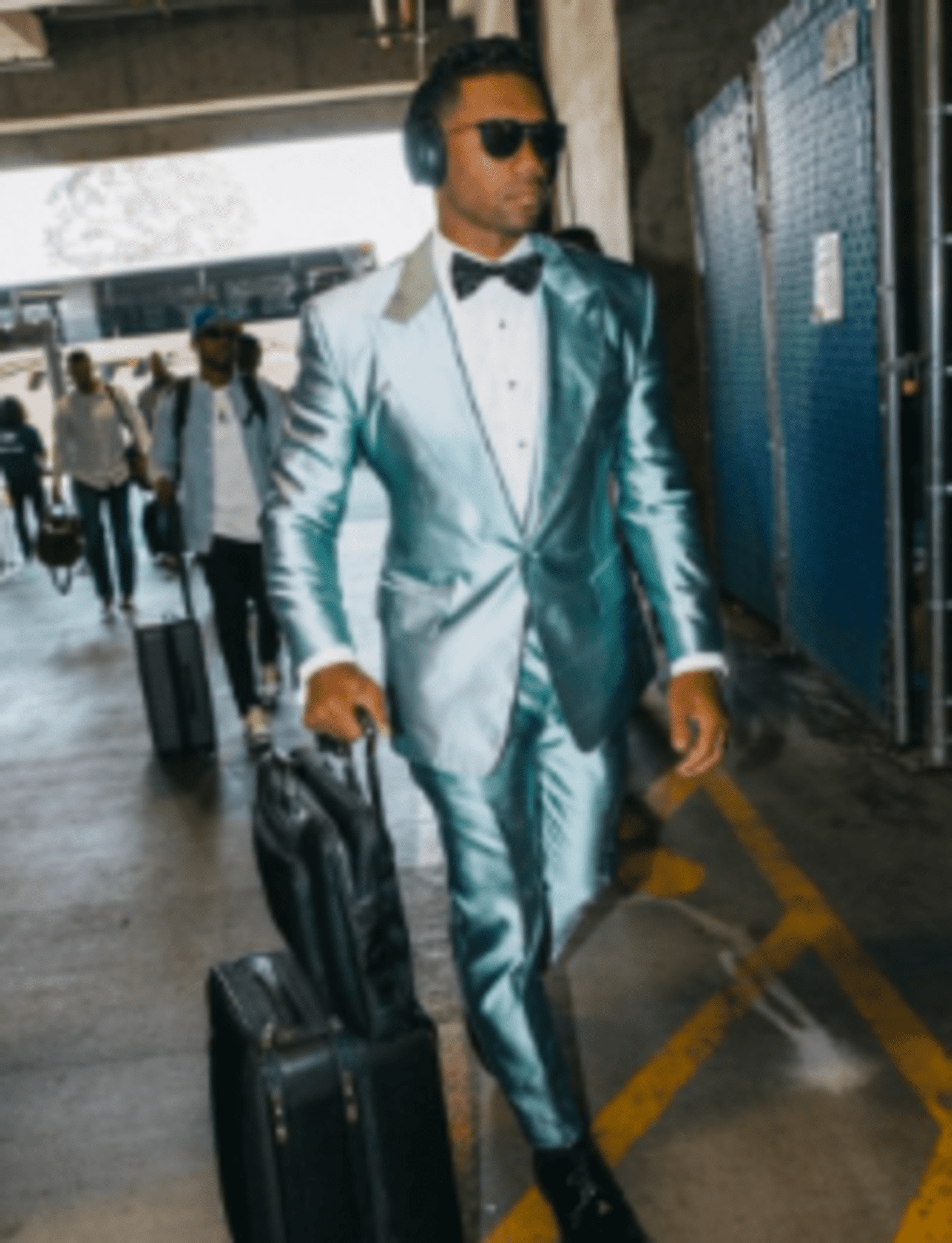 When Russell Wilson Wears This Metallic Suit, Fans Can't Look Away