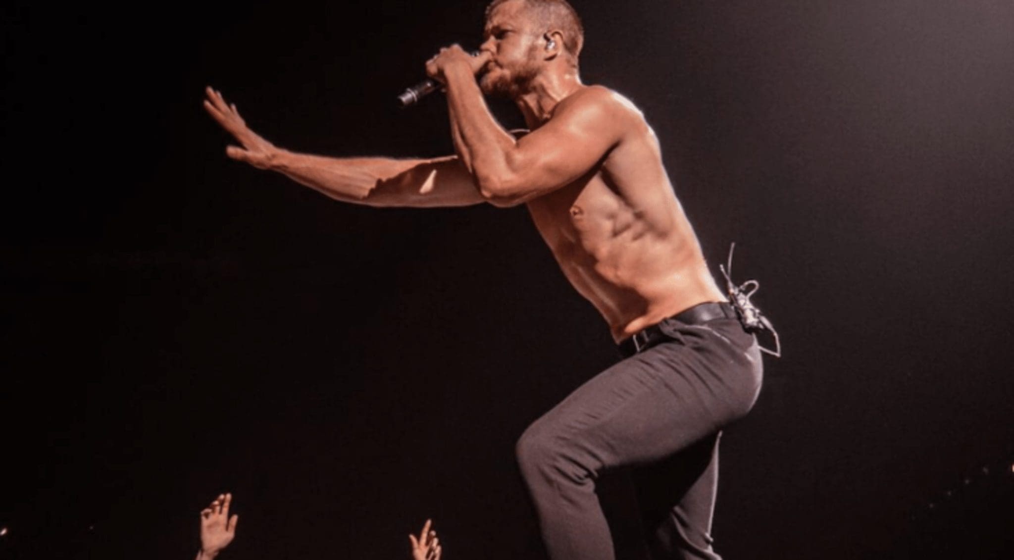 Following the postponement of multiple tour dates, frontman Dan Reynolds provided a shirtless health update.